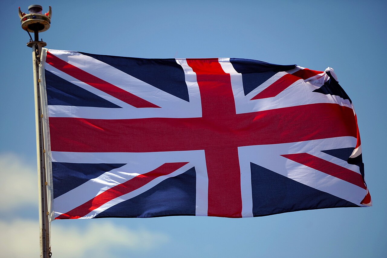 The Union Flag flying against a blue sky